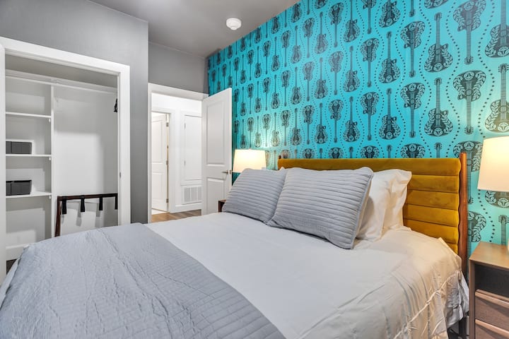 Queen bed and dark walls make this 2nd bedroom really cozy.