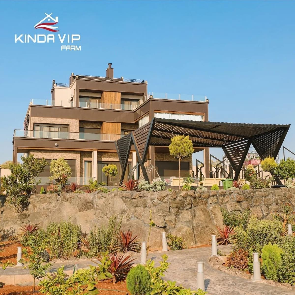 A modern structure with a mix of natural and contemporary materials is showcased. A spacious outdoor area features landscaped gardens, stone pathways, and a shaded terrace supported by a sleek black canopy, providing an inviting space for gatherings.