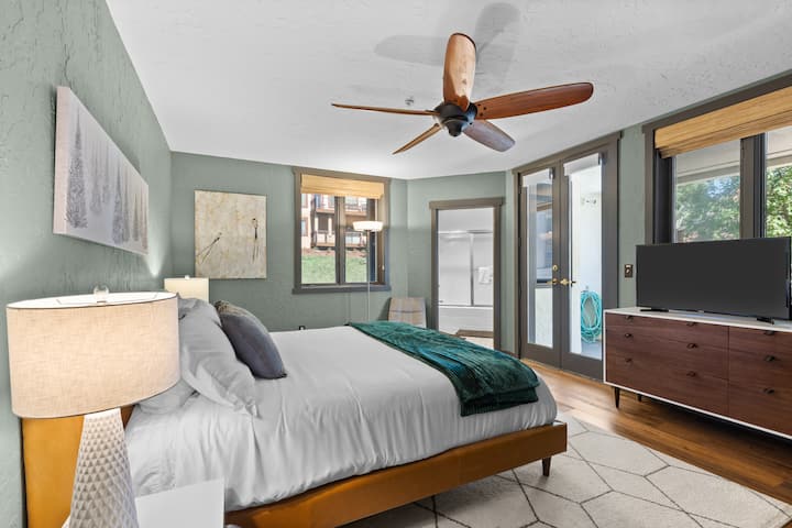 Main bedroom 1 with en-suite, large dresser for storage, closet to hang your things, and access to a large patio.  