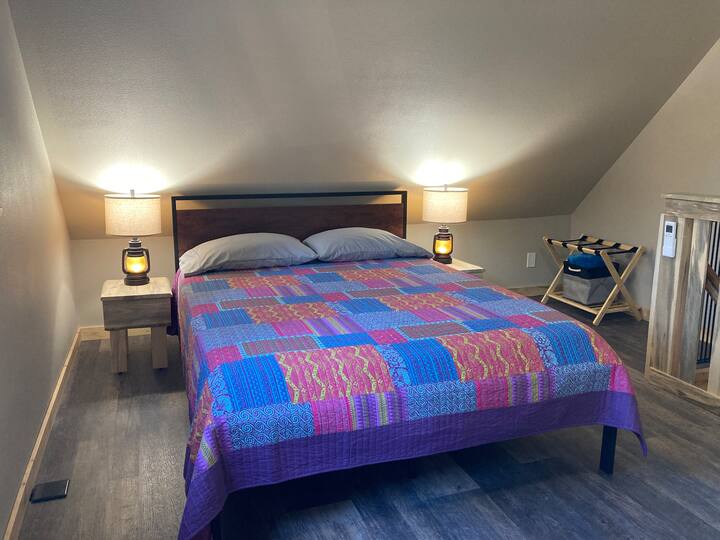 Two queen beds in the upstairs bedroom