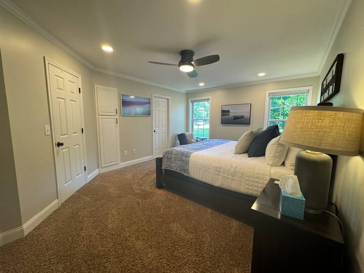 
The "Win" bedroom is on the main level and features a king bed, cellular blackout shades, a 50" Samsung Frame smart TV, dresser, California Closets, Elfa drawer solution, luggage rack, and laundry hamper.