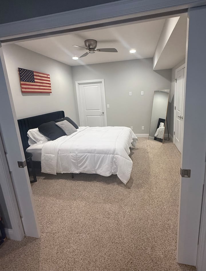 Queen bedroom in basement with lockable hideaway doors for privacy!