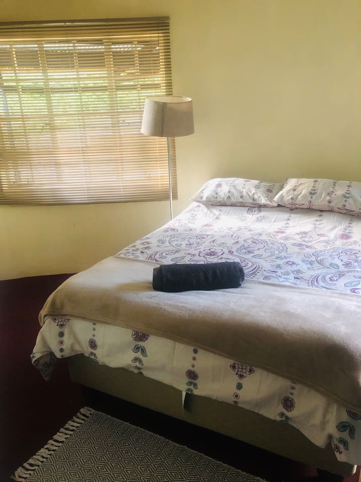 Downstairs bedroom with double bed and wardrobe
