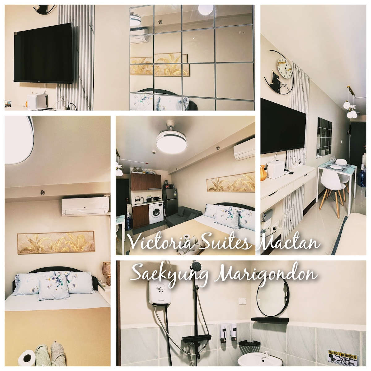 The image displays a compact living space featuring a double bed with decorative pillows. A television is mounted on the wall opposite the bed. A small dining area with white chairs is visible, along with a kitchenette and a decorative wall art piece, contributing to a cohesive design.