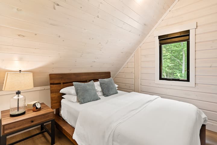 Upper level queen bed with sloped ceiling