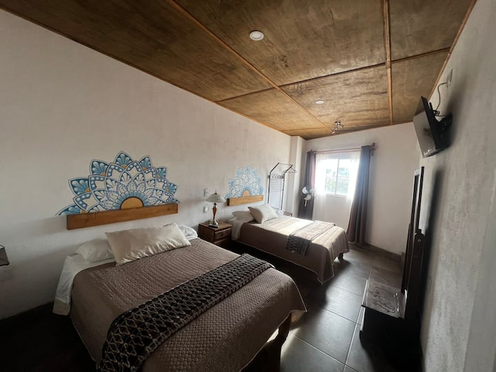 Camere spaziose, con dettagli pensati per il tuo comfort, TV e bagno completo