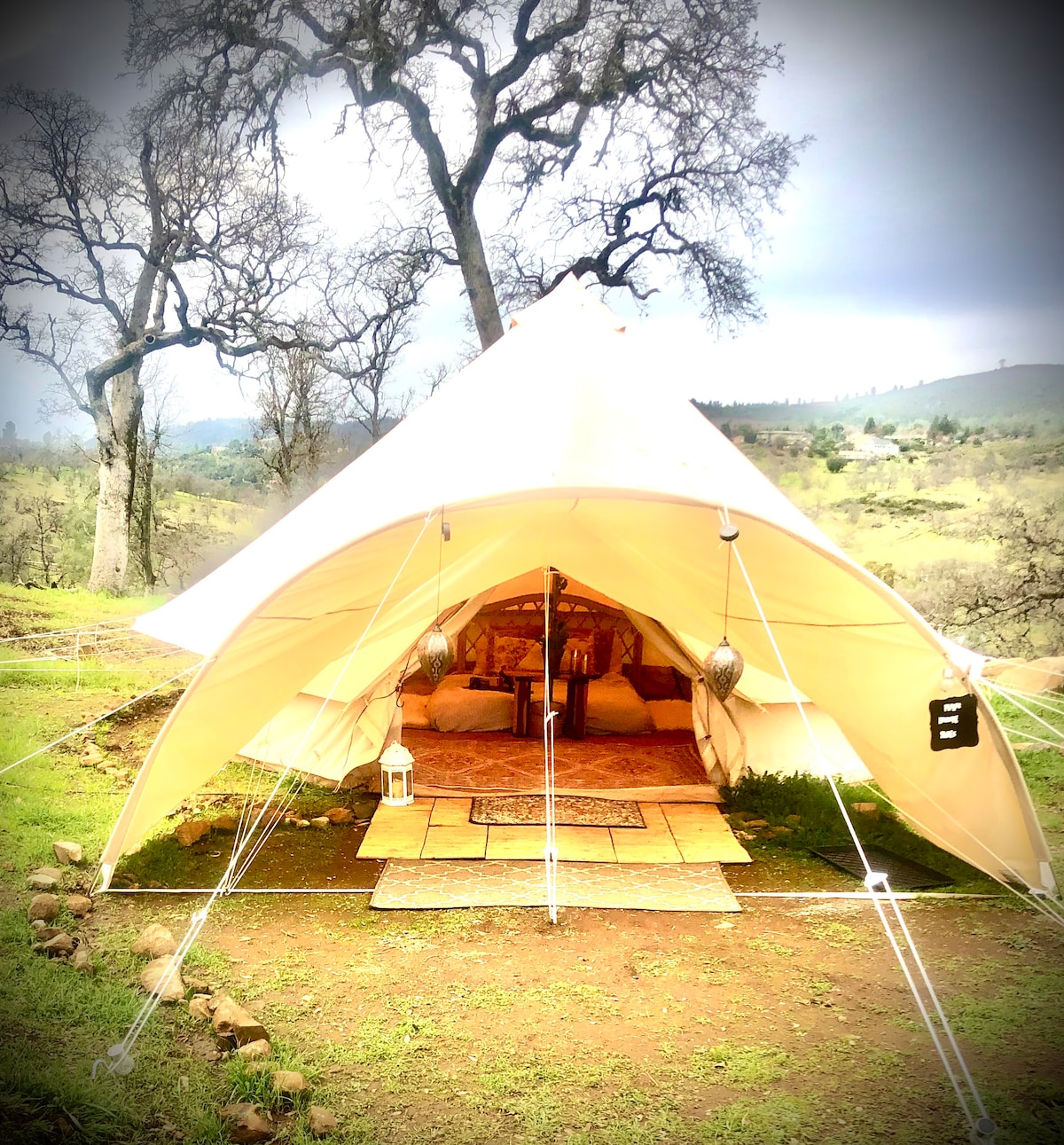 The arched canvas porch awning gives the Bohemian Belle the aura of a temple. She is truly a sacred space for divine connection with Earth and each other. at Bohemian Belle Yurt in
