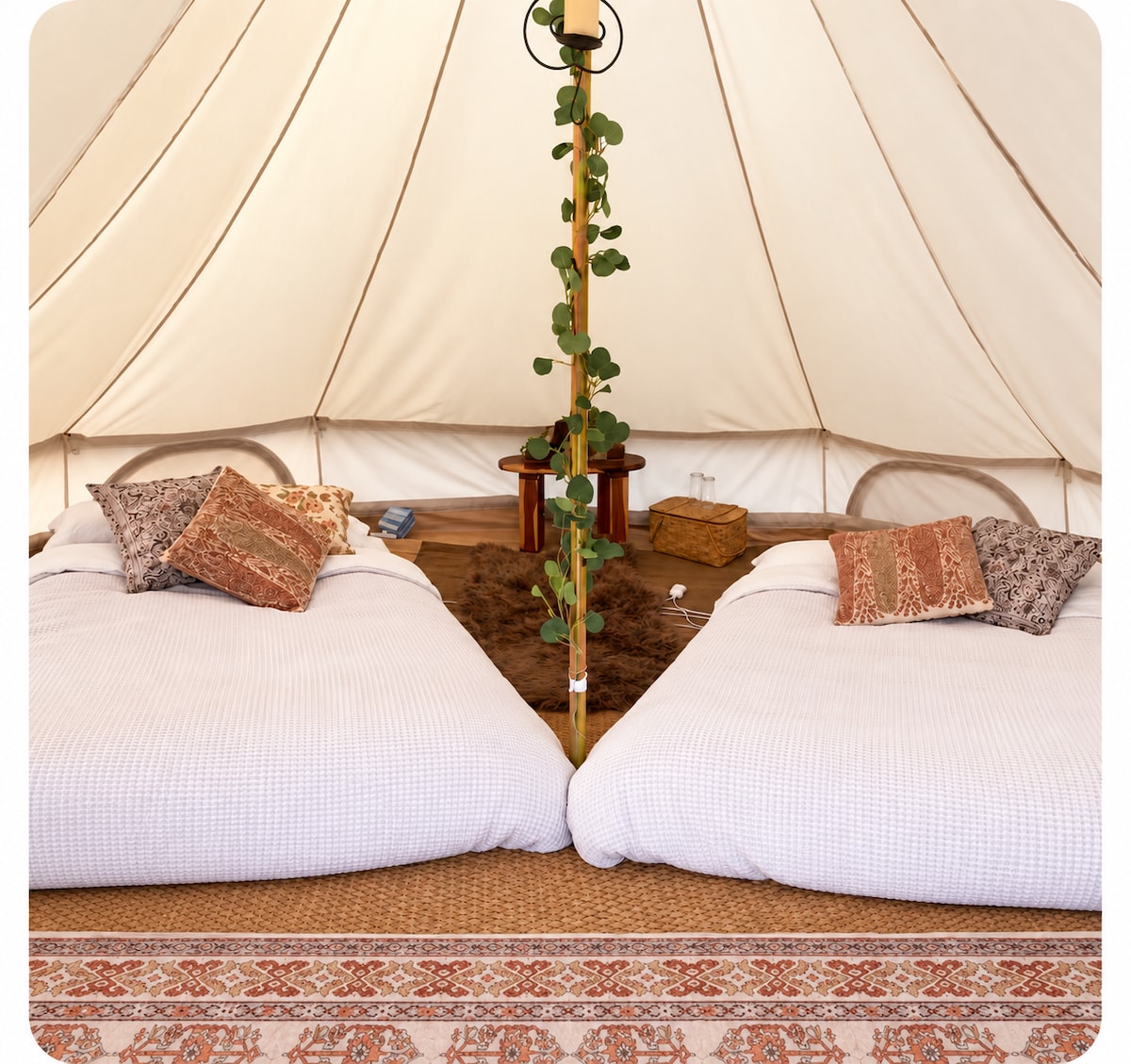 Two queen beds are available for a group of four to 5. at Bohemian Belle Yurt in Hidden Valley Lake