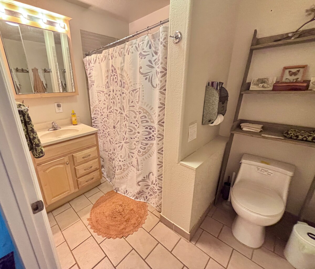 The SHARED guest bathroom ( in main house, 100 feet away) is open 24 hours for your use has organic amenities by Eo, cotton towels at Bohemian Belle Yurt in Hidden Valley Lake