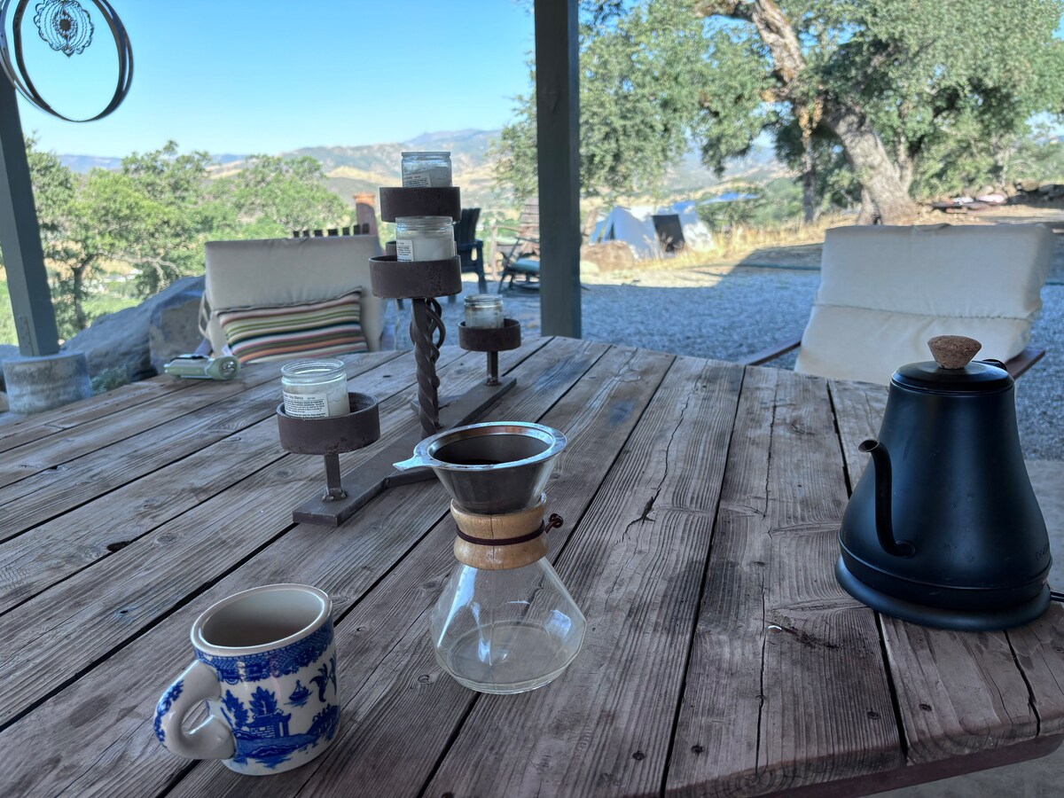 Guests love sitting in the SHARED covered pergola with amazing views, chatting with host and cohost or other guests, working on wifi. at Bohemian Belle Yurt in Hidden Valley Lake