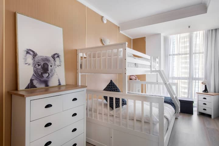 The 2nd bedroom or "kids retreat" featuring a double bunk bed, with a roll-out trundle underneath.