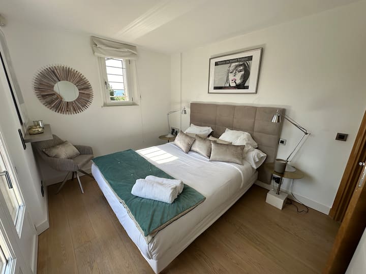 Air-conditioned bedroom 4. South balcony on garden and pool .