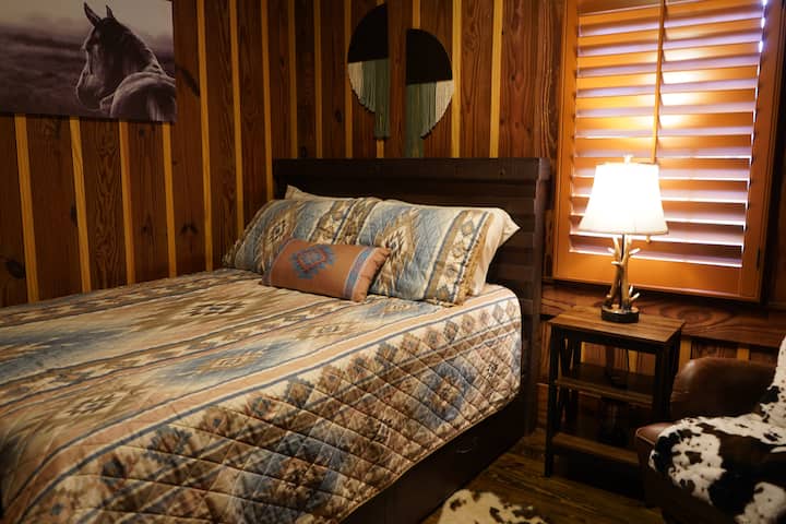 
Full sized bed with shelves including extra towels and blankets. Room also has iron and ironing board with additional hangers. 