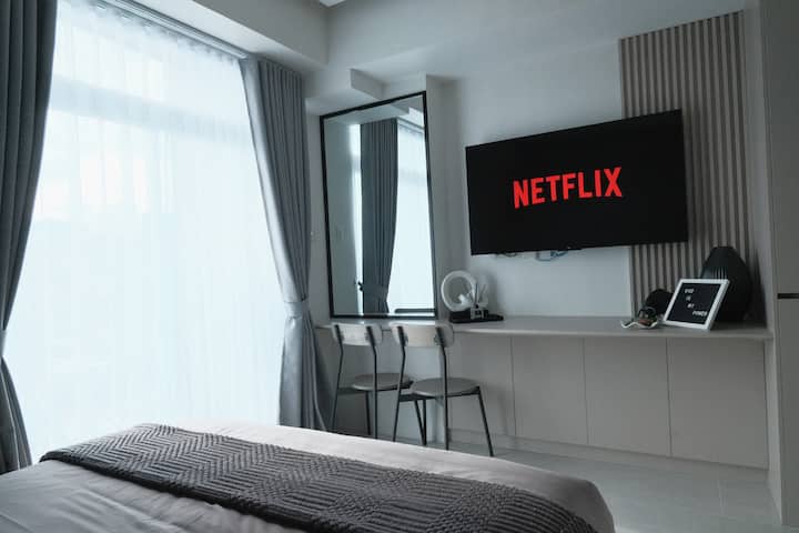 The room is filled with natural light during the day and designed with cozy, modern touches to make you feel right at home.