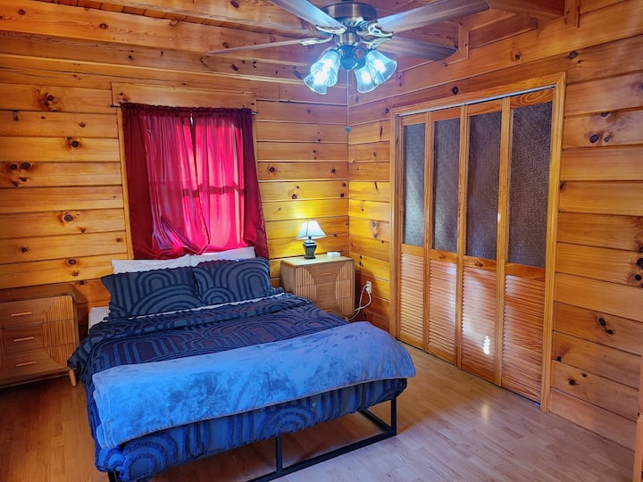 1st Floor - 2nd QUEEN BR

Cozy and comfortable with a queen bed, side table with lamp, closet, and drawers for storage,  a relaxing space to unwind and recharge.