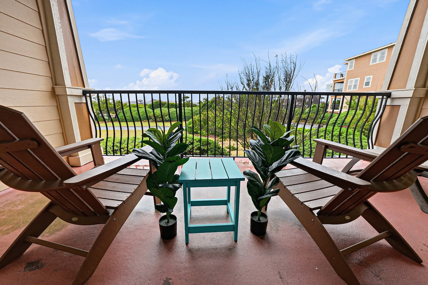 Enjoy quiet mornings and relaxing evenings on the private second-bedroom balcony with cozy Adirondack chairs and calming views.