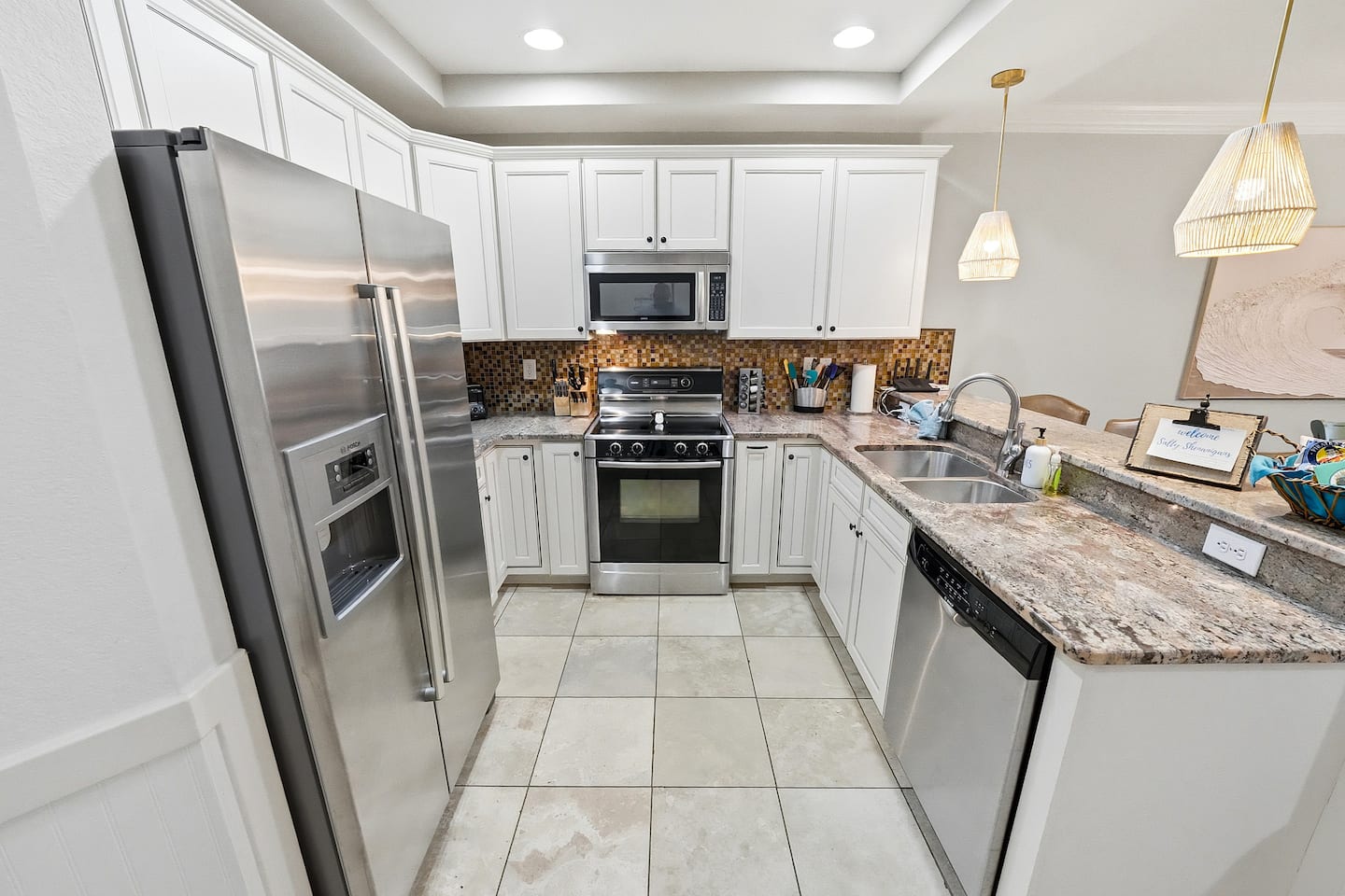 Bright, fully equipped, and designed for gathering, this kitchen has everything you need for family meals, morning coffee, and easy entertaining after a day at the beach.
