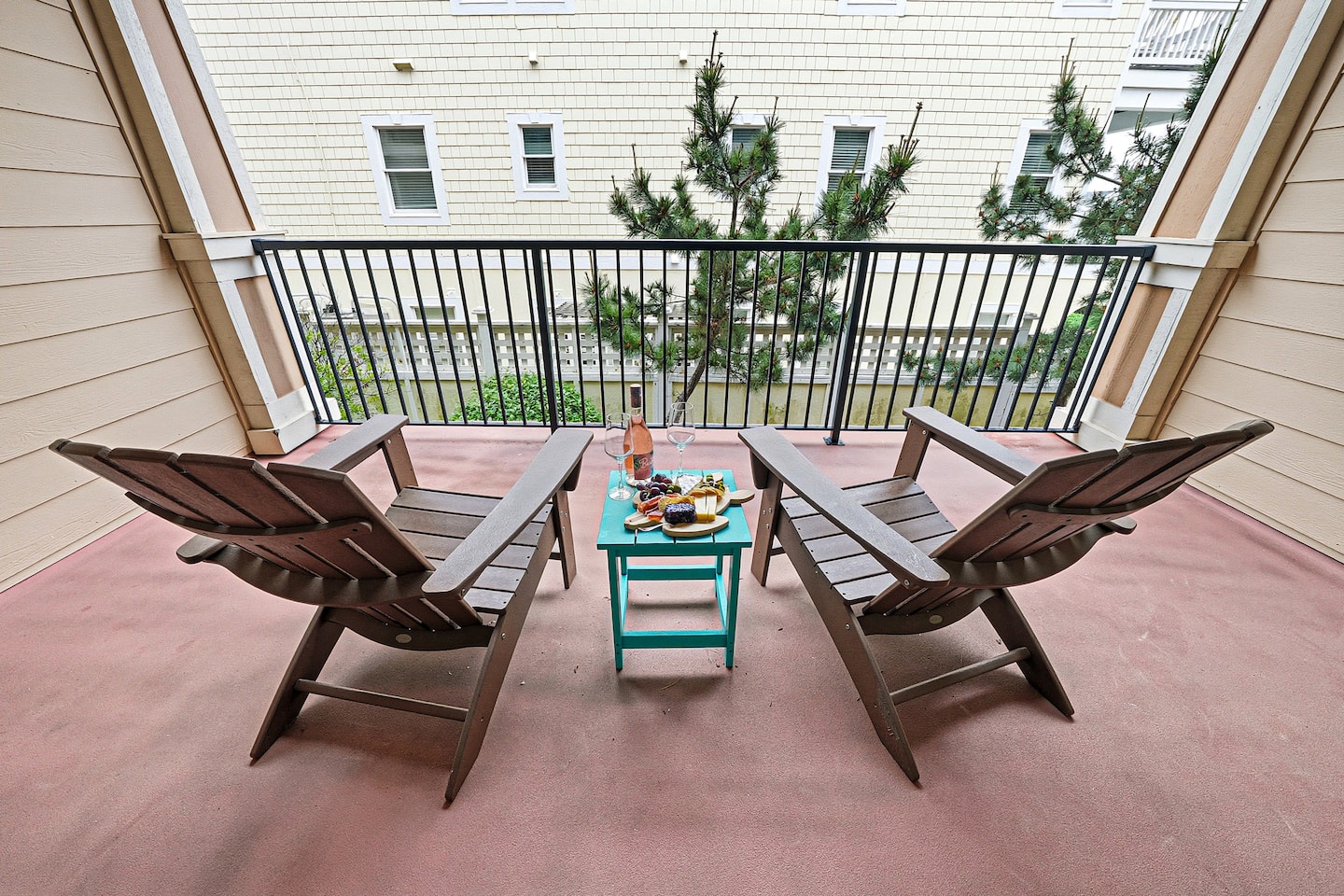 Relax on the spacious balcony off the master suite with comfortable Adirondack chairs and a peaceful setting for morning coffee or sunset conversations.