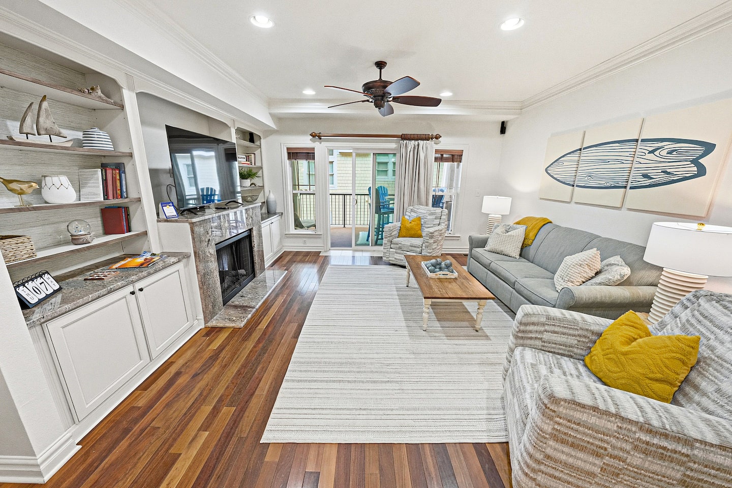 An open, airy space that flows seamlessly from the living room to the outdoor patio, perfect for keeping everyone connected, whether you're relaxing inside or stepping out for fresh coastal air.