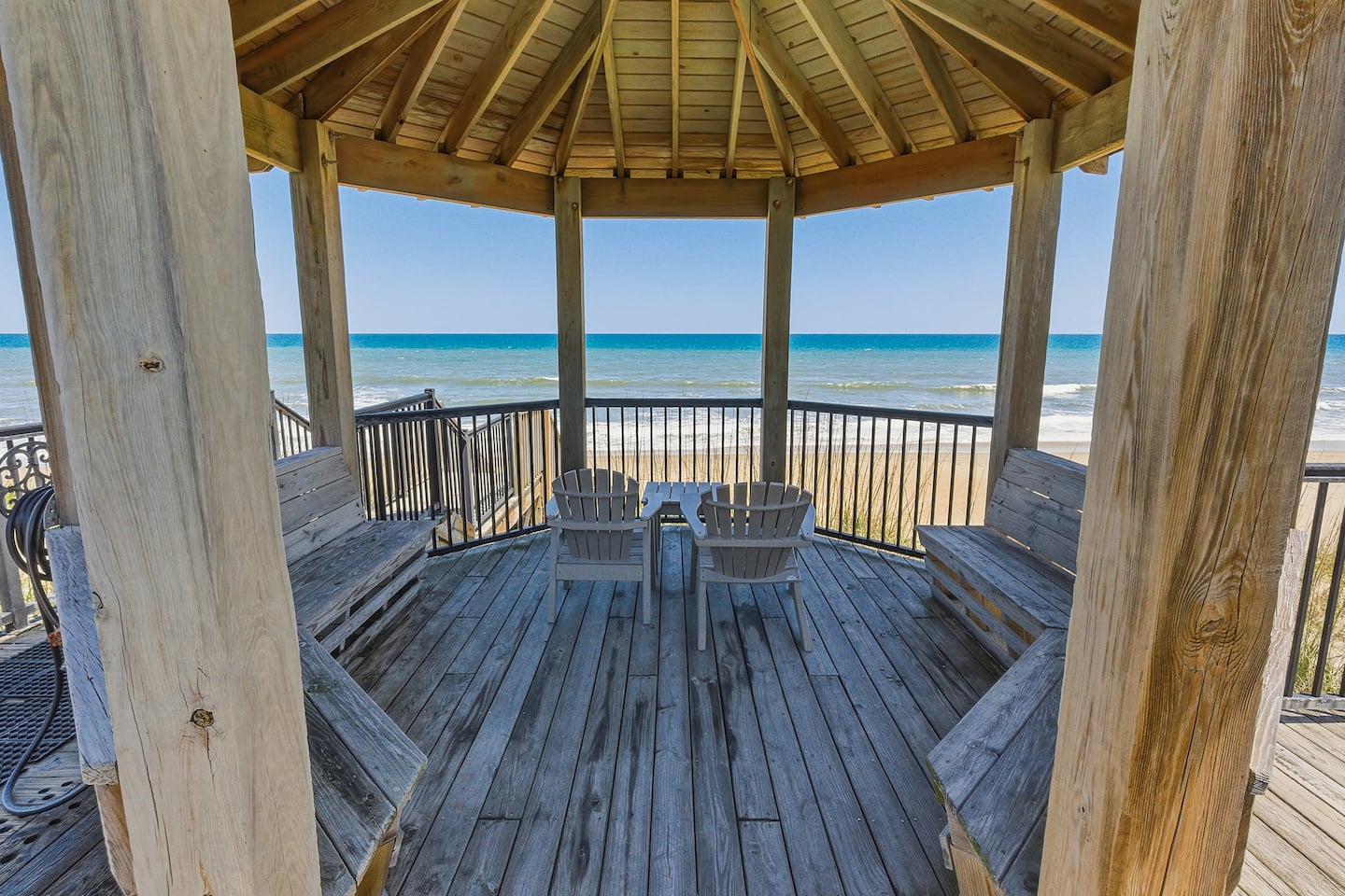 Grab two chairs in the open-air beachfront gazebo and face the ocean. No agenda, no schedule, just the sound of waves through the thatched-roof opening and the Atlantic in front of you.