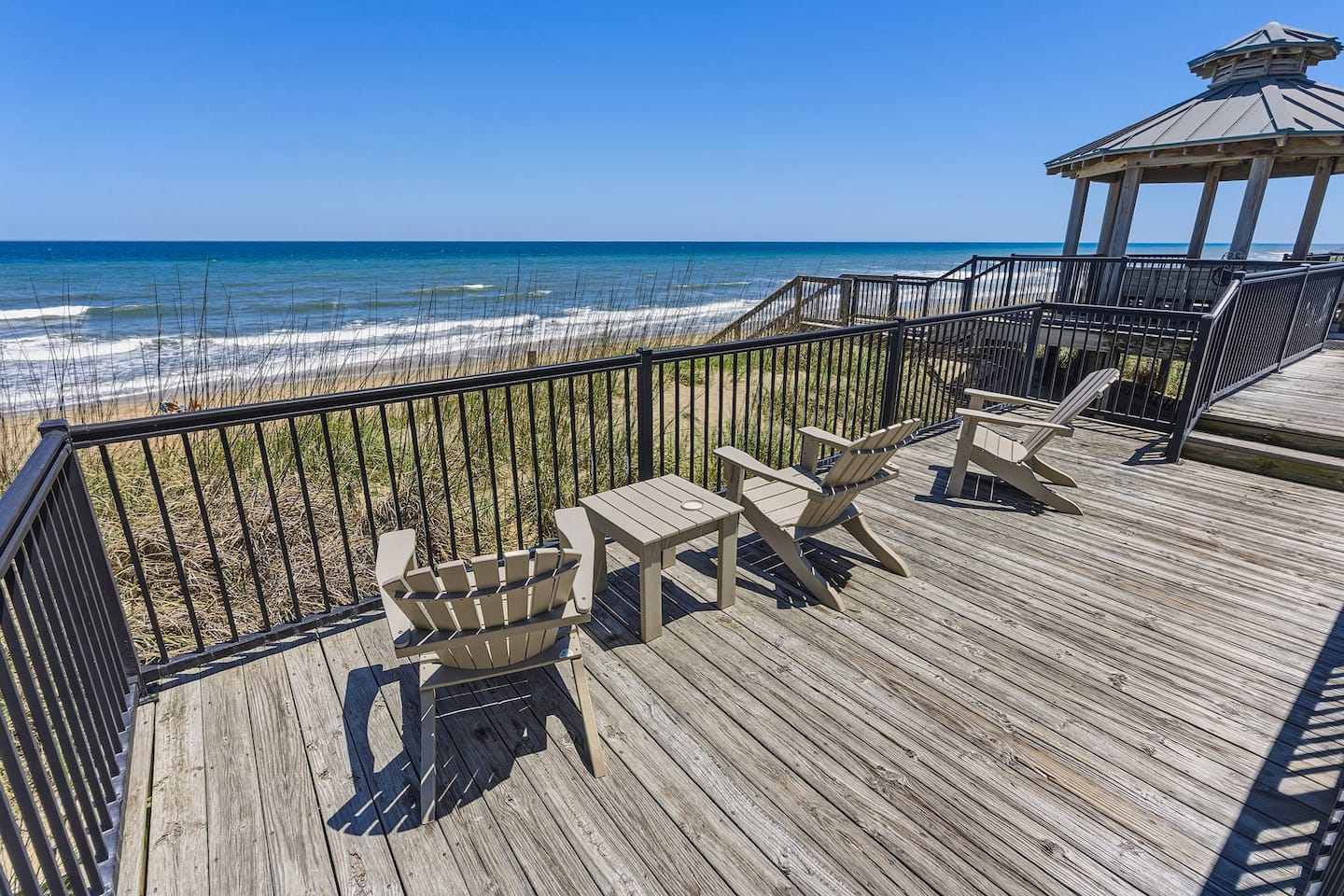 Spend your evenings here listening to the ocean, watching the kids play in the sand below, and making memories under the salty coastal breeze.