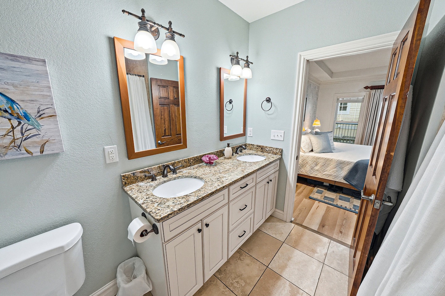 Bright and spacious ensuite bathroom with dual sinks, upgraded finishes, and convenient access from the primary bedroom.
