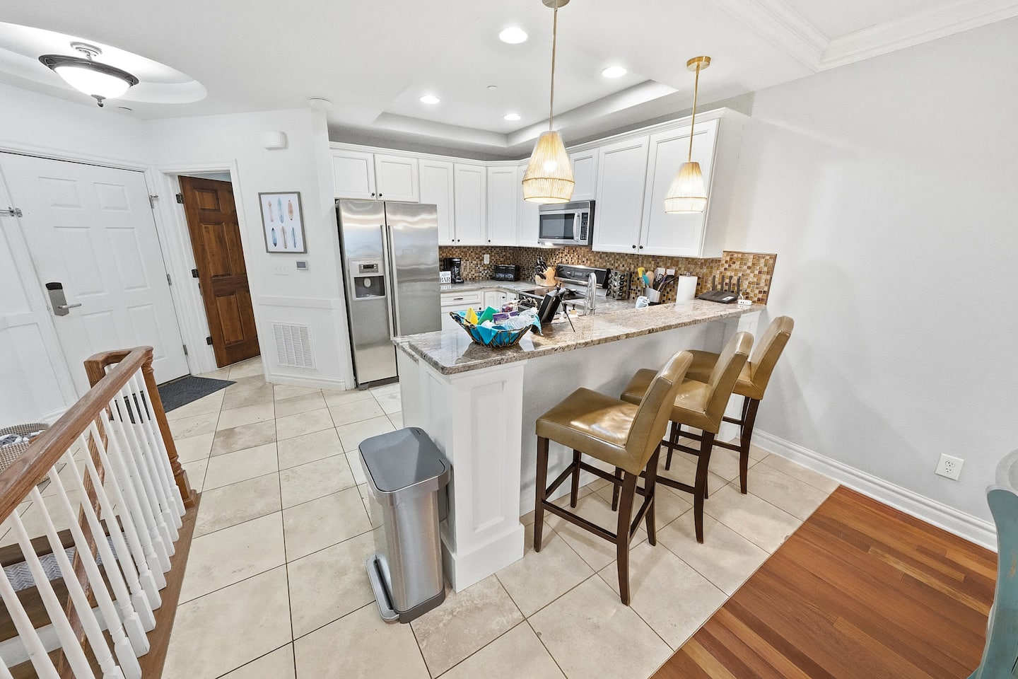 Start your mornings at the breakfast bar with coffee and a view of the open living space. There's always a seat, always counter space, and always someone within easy reach of the kitchen.