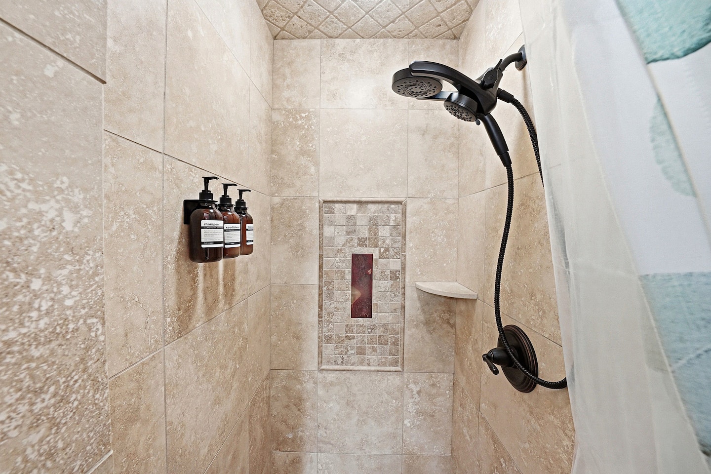 Refresh and recharge in the beautifully tiled walk-in shower designed with comfort and coastal-inspired style in mind.
