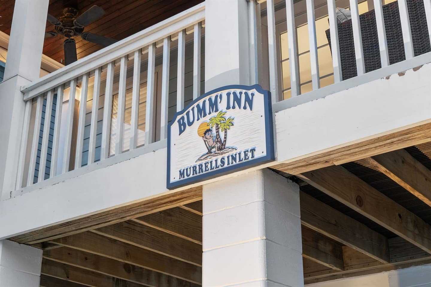 Pull up to the Bumm'Inn. Second row to the sand, six bedrooms, and a sign that means your group vacation has officially started.