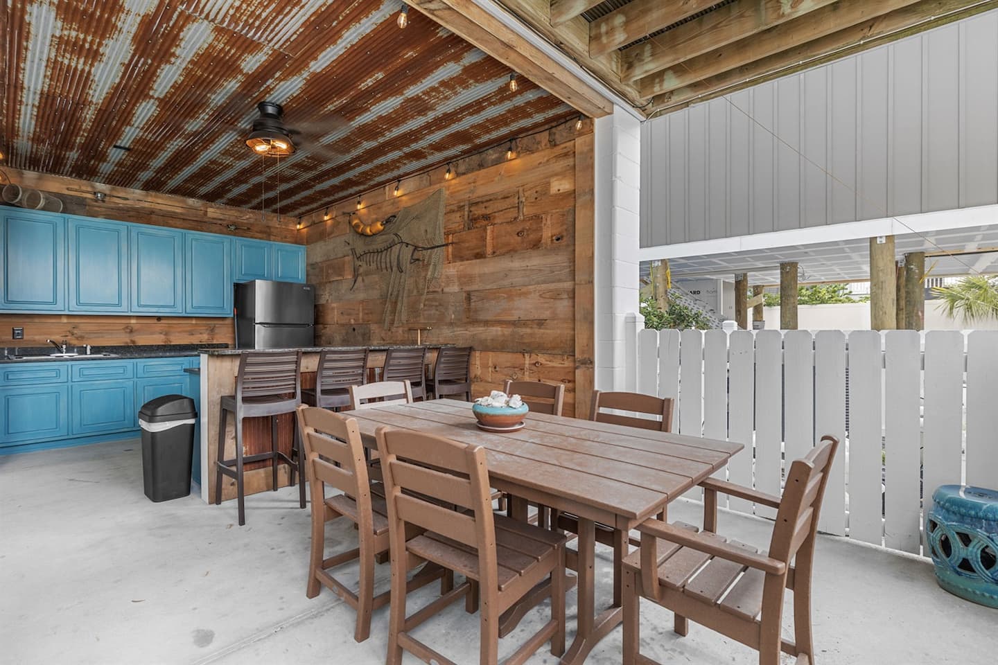 Gather the whole crew around the outdoor table where the meals run long and nobody checks the time.