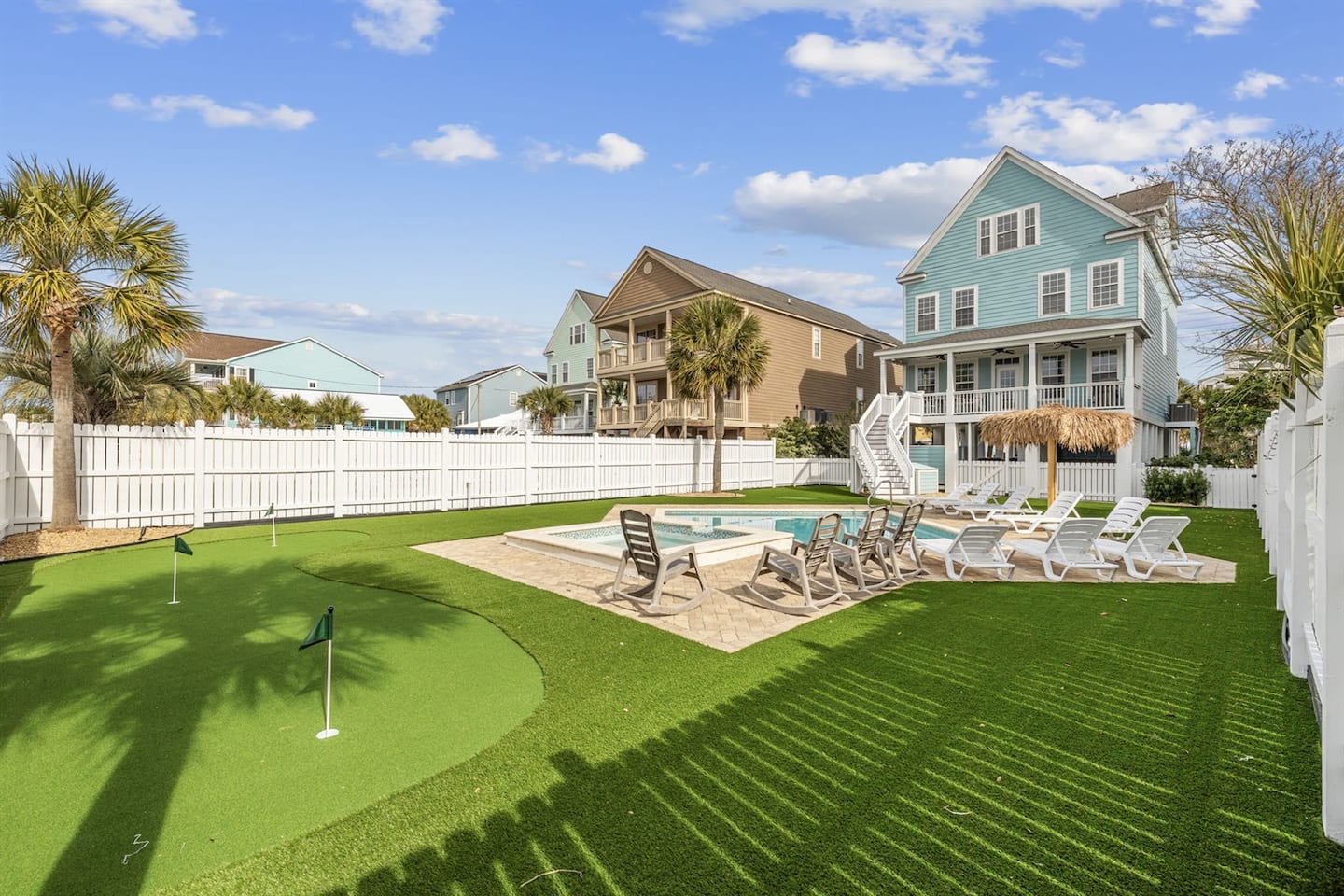 Spread out across the pool deck where the loungers, the shade, and the water all sit within a few steps of each other.