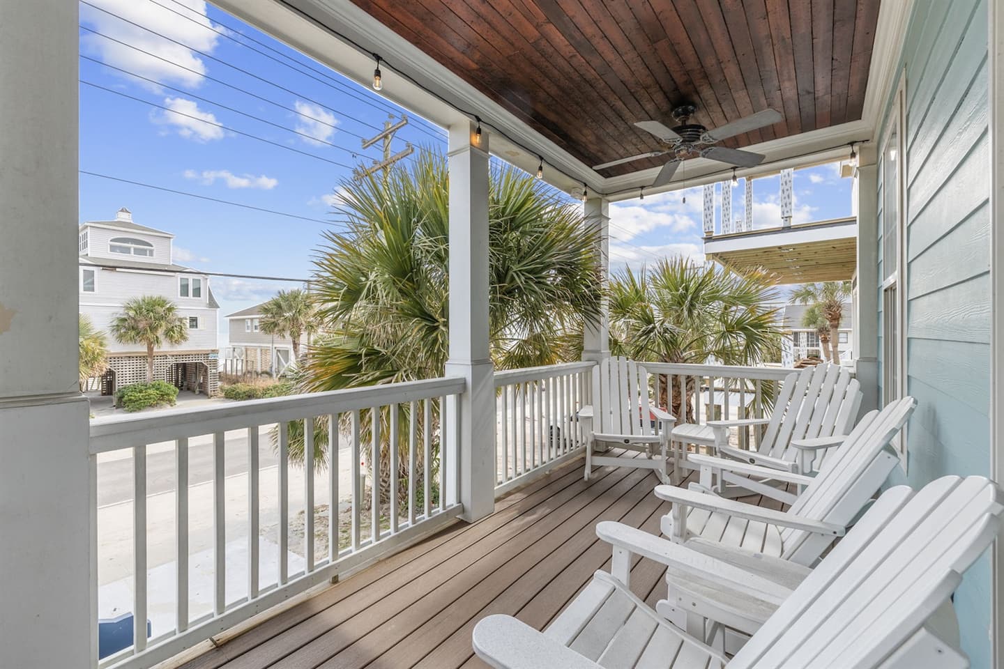 Rock away the evening on the front porch while the kids have the fenced yard to themselves below.