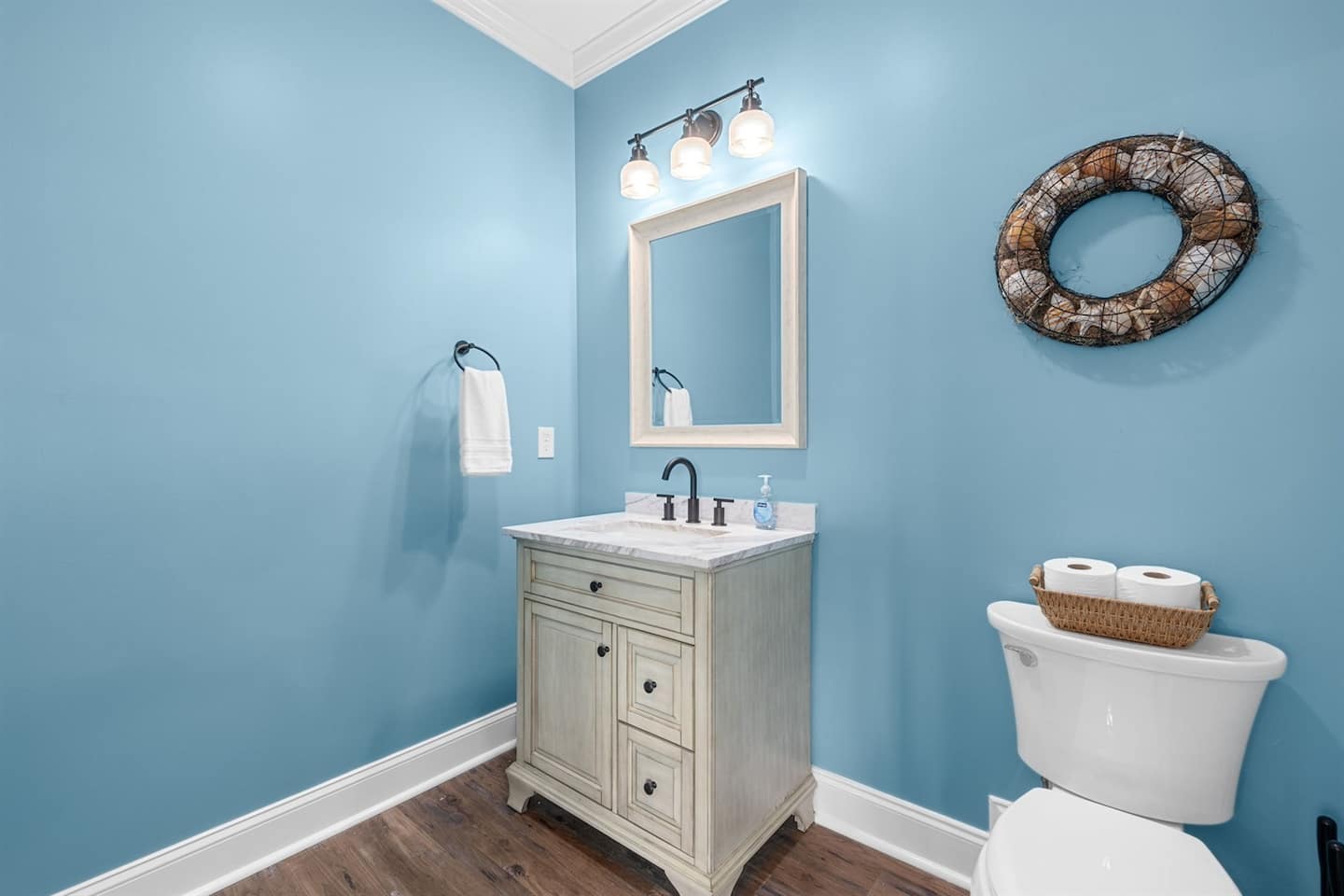 Send guests to the half bath off the living area so the bedrooms stay private.