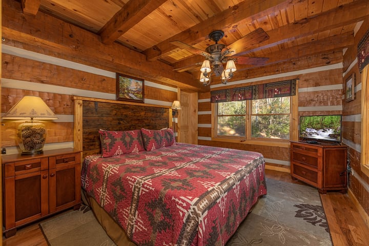 Main floor king bedroom - sleep comfortably in a quiet, private setting -  king bed and space to truly relax. Connects to the bathroom; smart TV