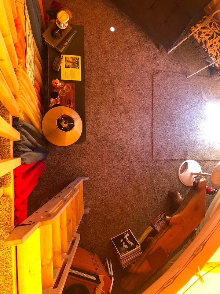 View from loft, futon and overnight “potty” chair.