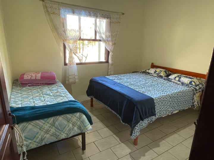 Bedroom 3 backgrounds with double bed and 1 single bed, plus 1 extra double mattress and 1 extra single mattress