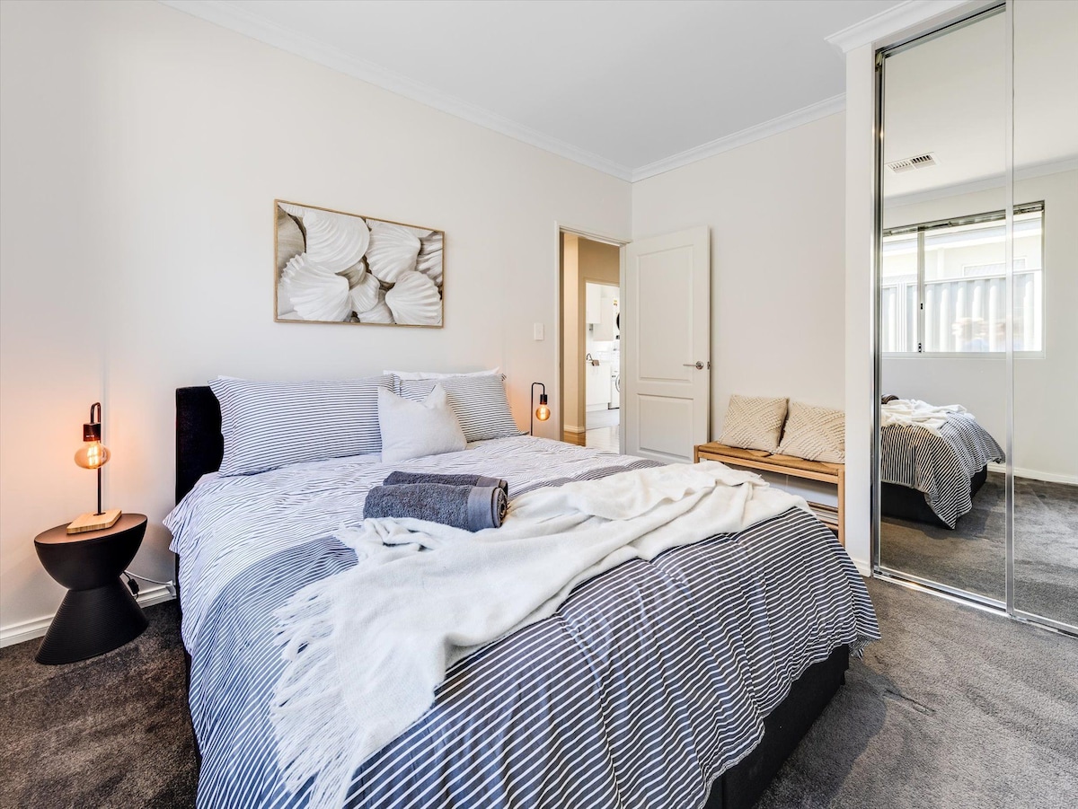 queen bed featuring additional storage draws on wheels. loads of hanging space included in the built-in-robes and bench seat.