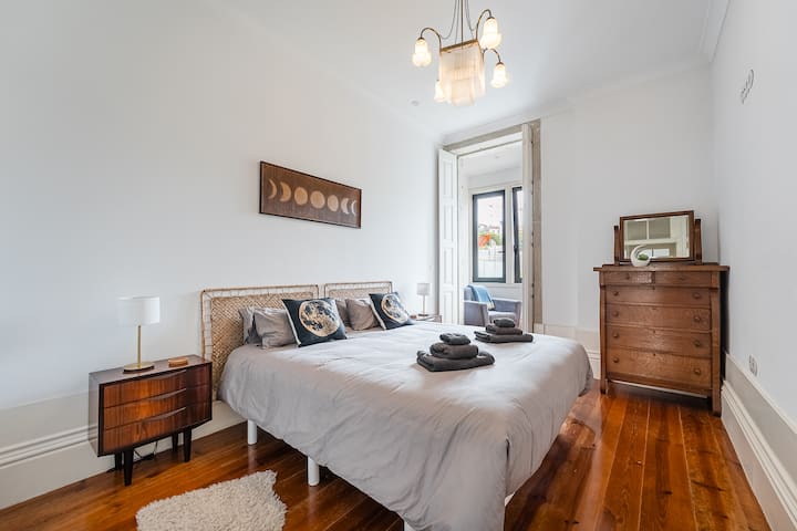 A serene, light-filled bedroom with a touch of celestial charm. The bed can be set up as a spacious king or two cozy twins to suit your needs.