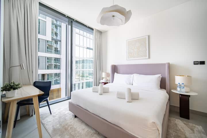 Wake up to natural light with floor-to-ceiling windows and blackout curtains for restful sleep when you need it.

