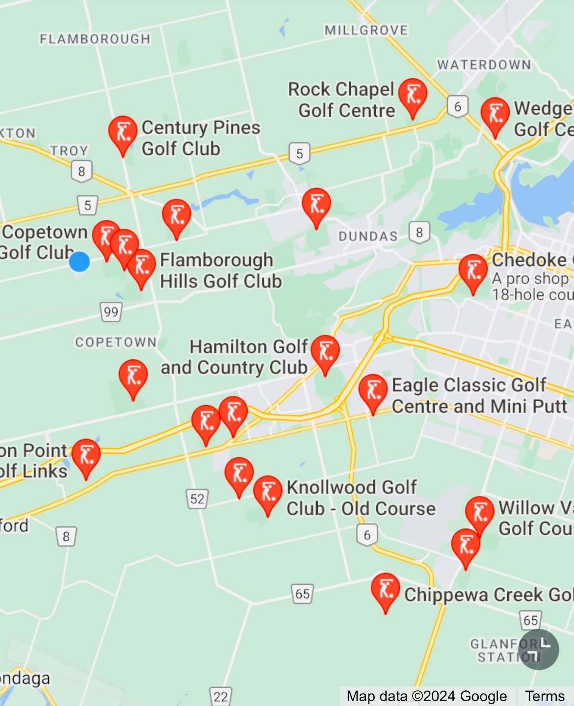 A map displays various golf course locations in the Hamilton area. Each icon indicates a golf club, showcasing proximity to the listed suite. Distinct landmarks and roads are featured, emphasizing easy access to golfing options within a short distance.
