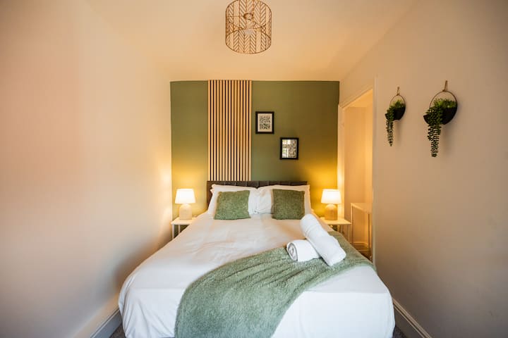 Unwind in the comfortable bed after a busy day, with bedside lighting and a mirror making it easy to settle in. Guests can relax, get ready for the day and enjoy a restful night with the wardrobe providing convenient storage during their stay.