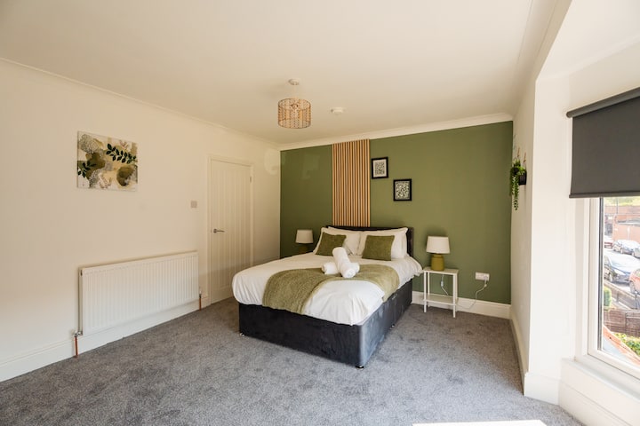 Unwind in the comfortable bed after a busy day, with bedside lighting and a mirror making it easy to settle in. Guests can relax, get ready for the day and enjoy a restful night with the wardrobe providing convenient storage during their stay.