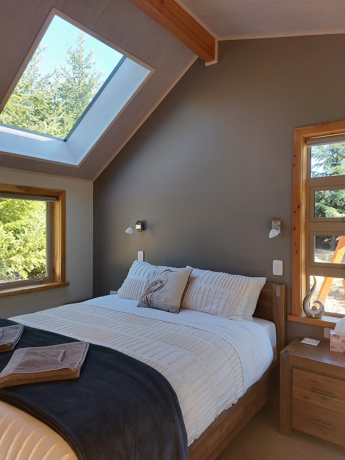Our master bedroom has a ceiling window so you can admire the stunning night sky at night. Eye masks are there for you to use if you wanted to have a sleep in and find the room too bright. 