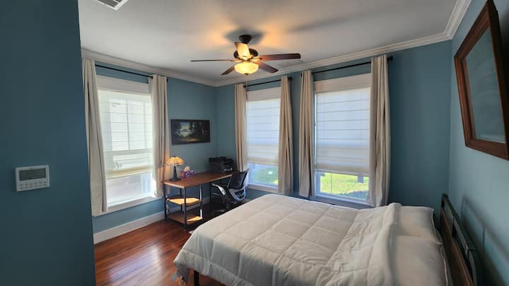 Enjoy soaring crown molding, original wood flooring, printing and copying station, individual HVAC control, antique pastel art, large closet, tiffany-style lamp, queen-size hybrid memory foam bed, and 3 expansive windows in the main bedroom! 