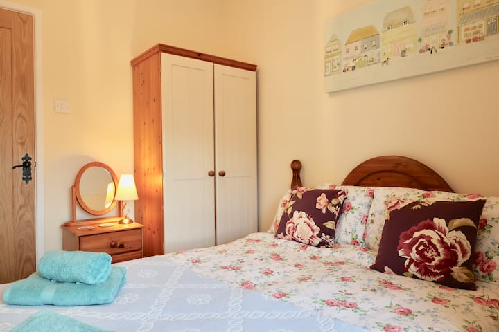 The third bedroom overlooks the garden and village beyond.