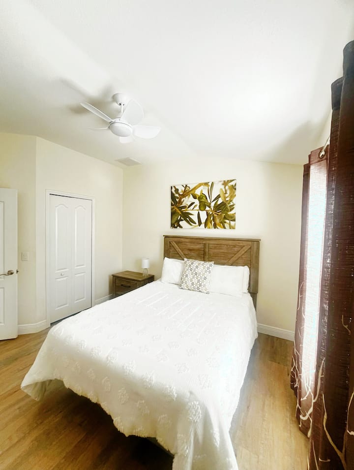 Spacious, main floor bedroom next to full bathroom. Full-sized memory foam mattress, walk-in closet, plenty of storage for clothing, room darkening shades.