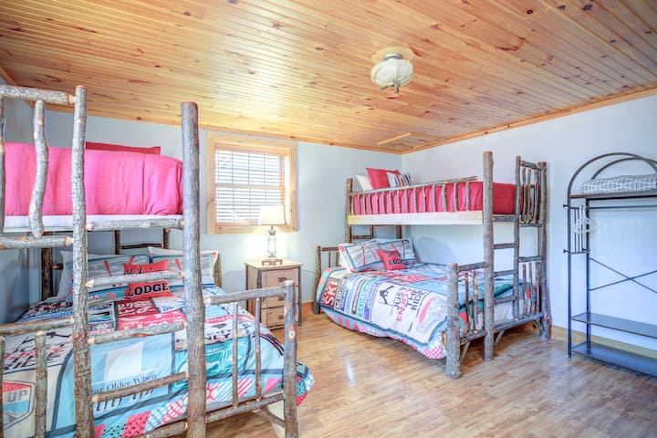 Bunk room with two twin XL upper beds and two queen lower beds