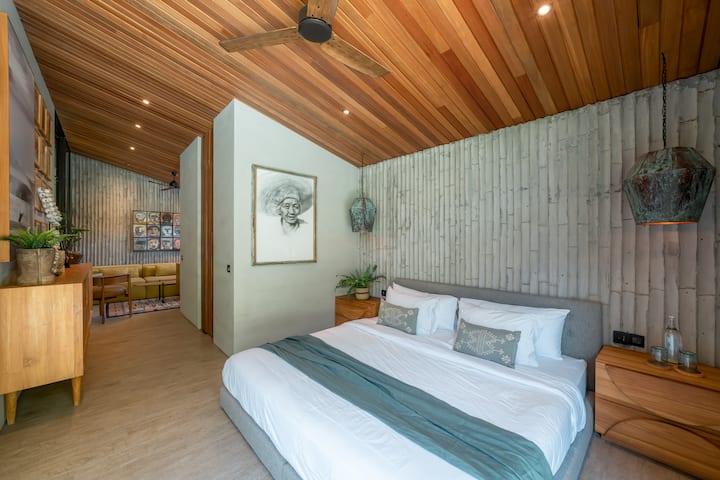 Discover our inviting bedroom, completes with a sofa for added comfort