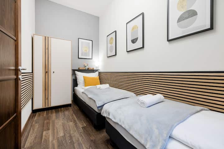 This is the smallest bedroom with 2 single beds.