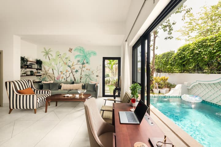 A serene space to work while looking outside the crystal blue waters of the swimming pool